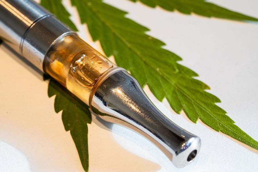 cbd vape oil with marijuana leaves